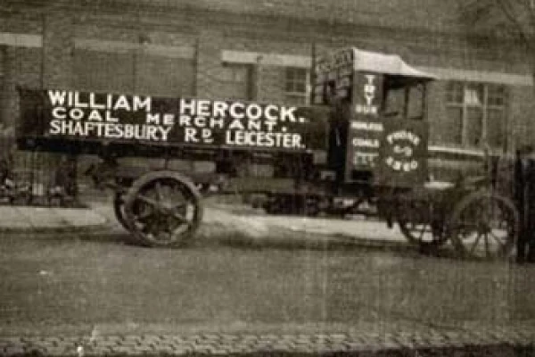 An old photo of a 1921 truck featuring William Hercock's logo
